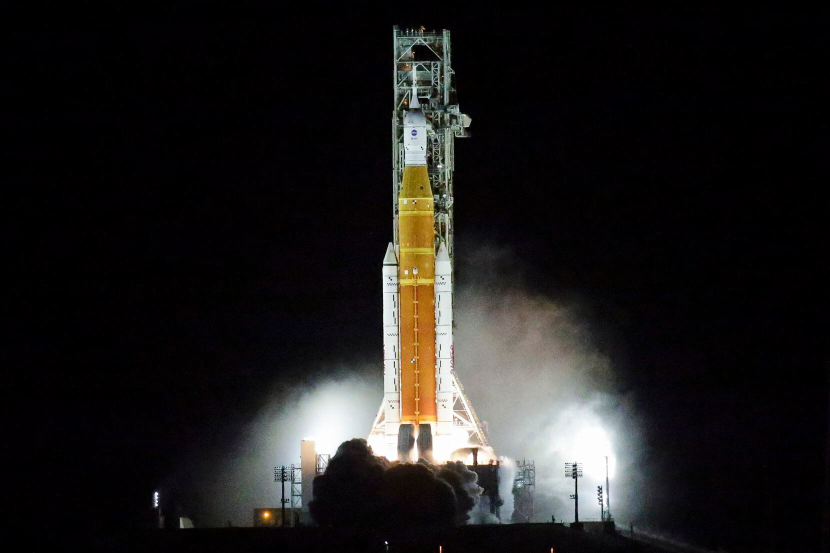 NASA's new moon rocket lifts off from Launch Pad 39B at the Kennedy Space Center in Cape...