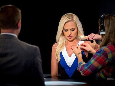 Greenville City Councilman Brent Money (left) looks on as Tomi Lahren is prepped for a...