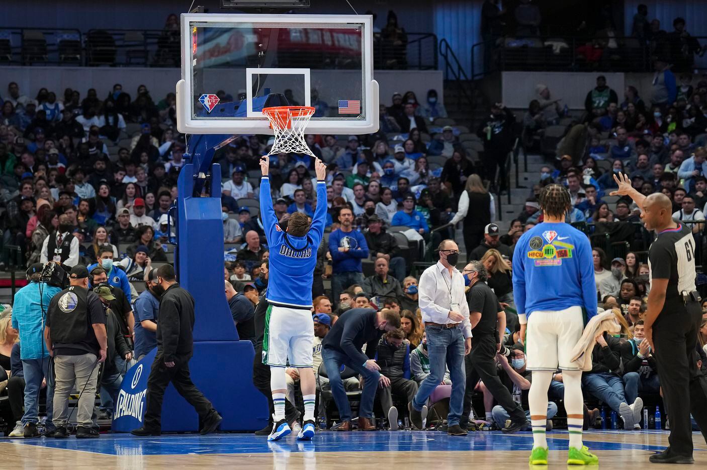 Dallas Mavericks guard Luka Doncic checks a new basket during the first half of an NBA...