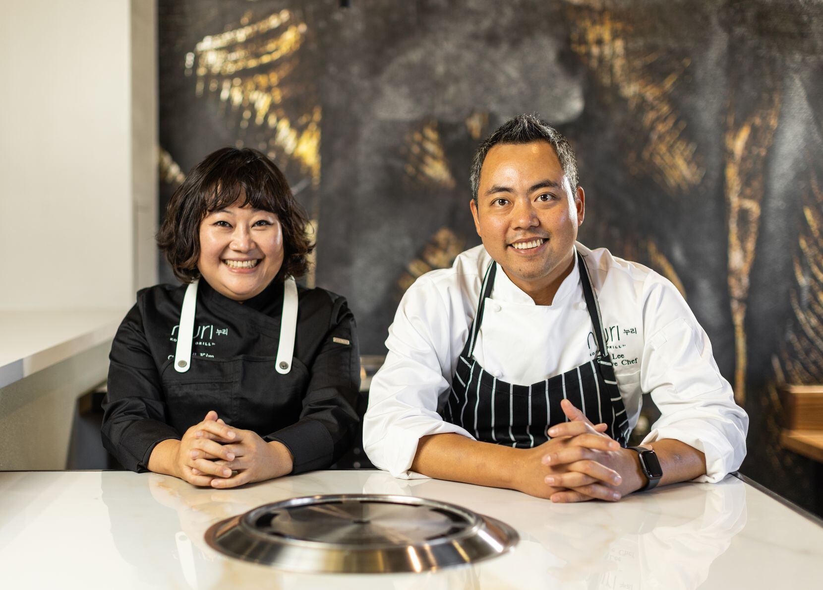 Chefs Minji Kim and Ben Lee of Nuri Grill in Dallas.