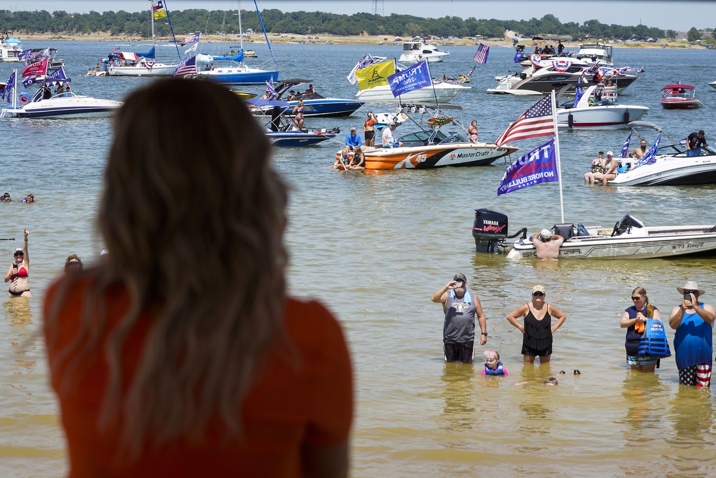 Shelley Luther, owner of Salon  la Mode,  addresses supporters of President Donald Trump during a campaign rally and boat parade at Oak Grove Park on Grapevine Lake on Saturday, Aug. 15, 2020.