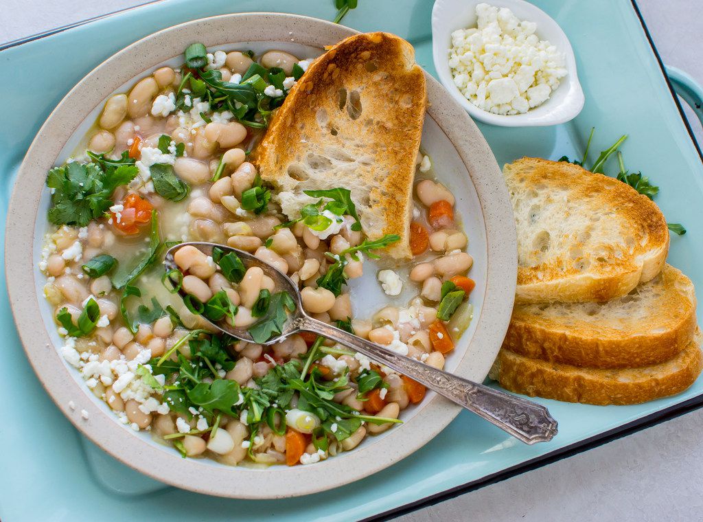 Instant Pot White Bean Soup with Greens and Goat Cheese is made with dried beans.