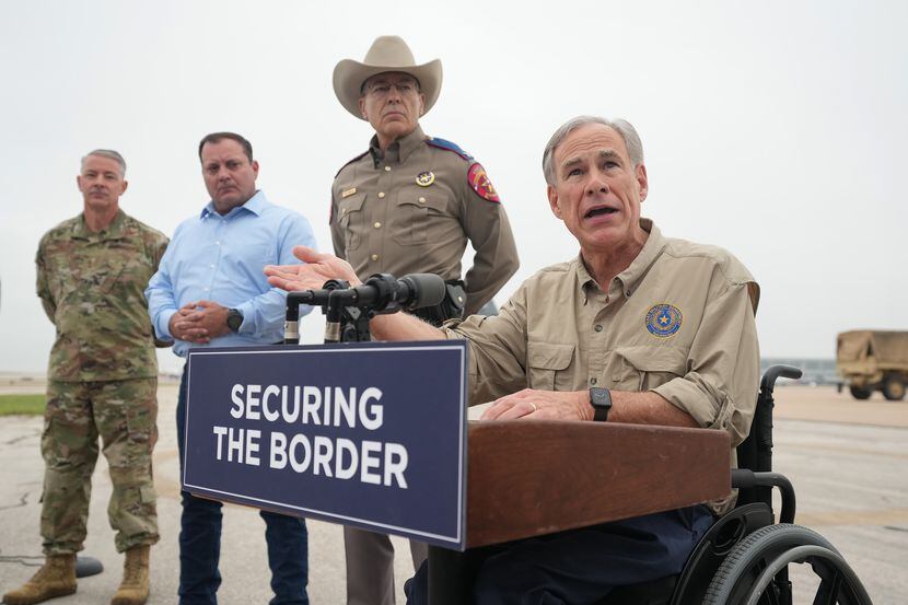 Gov. Greg Abbott spoke at a news conference as Texas Army National Guard troops deployed...