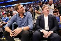 Dirk Nowitzki, former Mavericks player, left, and Patrick Dumont, new Mavericks governor,...