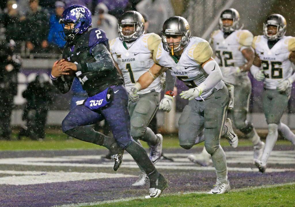 TCU Horned Frogs quarterback Trevone Boykin (2) runs in for a touchdown in the first...