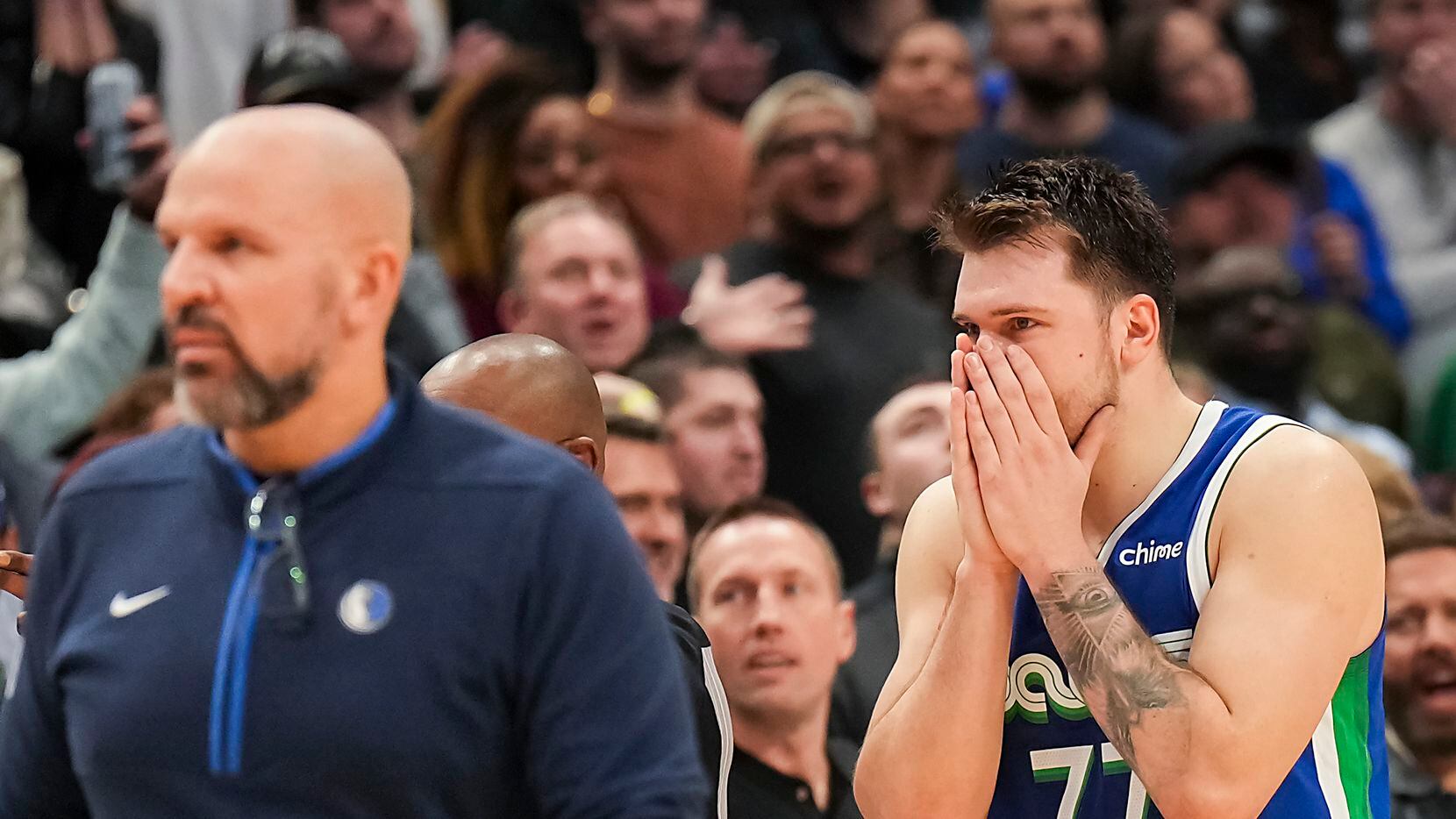 Dallas Mavericks guard Luka Doncic (77) reacts after being called for a foul sending...