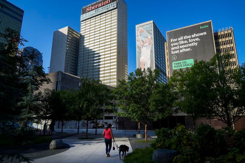 Sabrina Abney walks her dog Harry at Pacific Plaza downtown on Tuesday, Aug. 24, 2021, in...