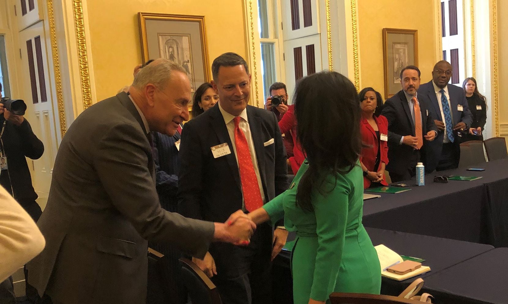 Senate Majority Leader Chuck Schumer greets state Rep. Victoria Neave, D-Dallas, as he meets...