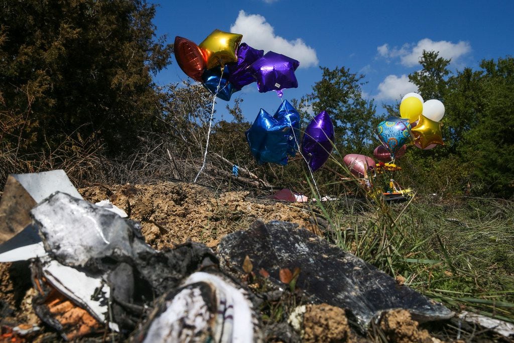 Balloons fly at the site of a memorial where one student died Wednesday when a Mesquite ISD...