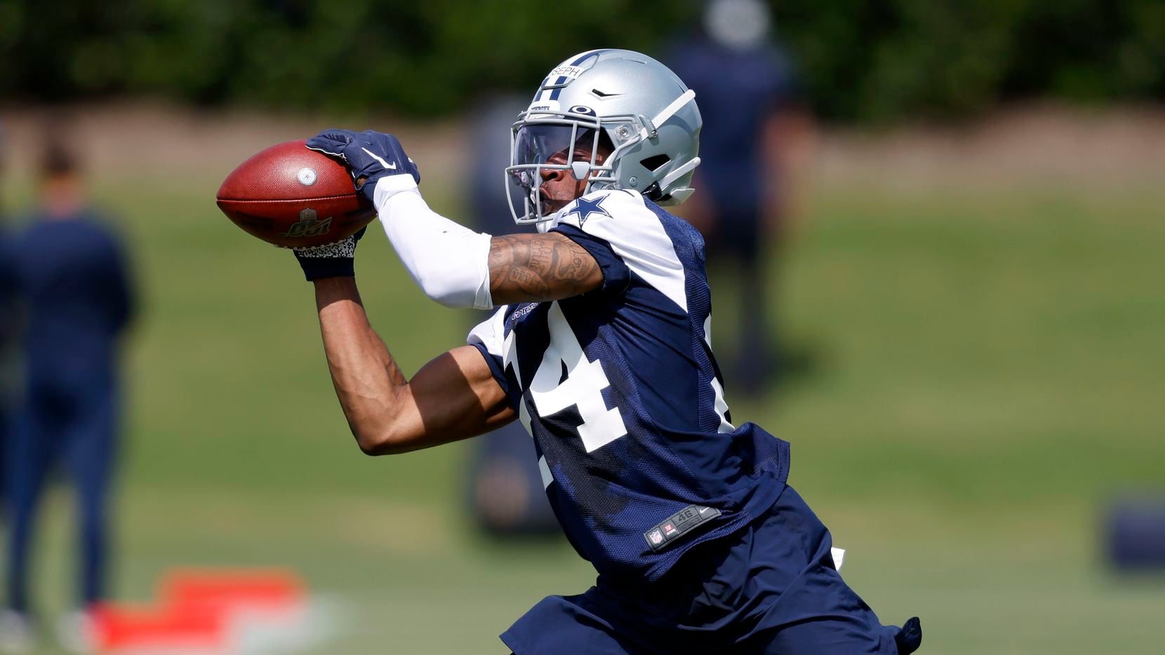 Dallas Cowboys rookie cornerback Kelvin Joseph (24) caches a pass during a defensive drill at rookie minicamp at the The Star in Frisco, Texas, Saturday, May 15, 2021.