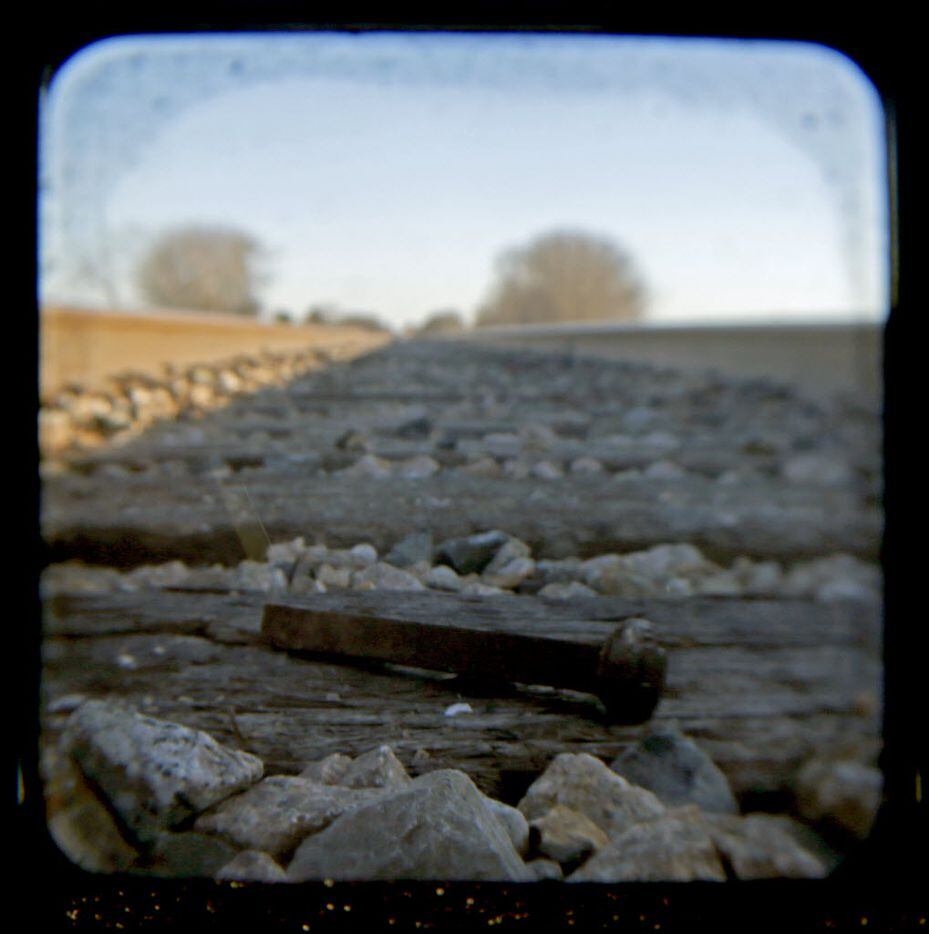 An old railroad spike was one of several along the tracks that run parallel to SH 289...