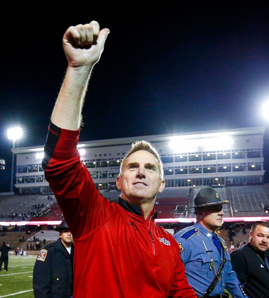 Arkansas State head coach Blake Anderson celebrates as he walks off the field after an NCAA...