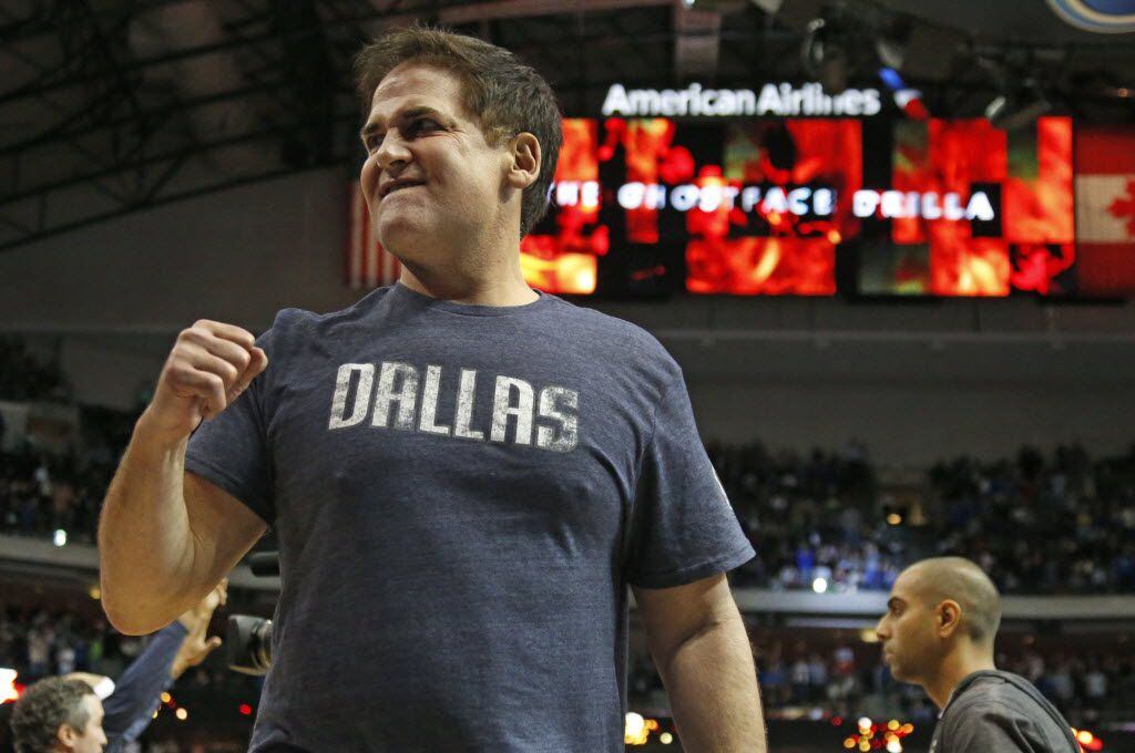 Dallas owner Mark Cuban pumps his fist as Dallas pulls away in overtime of their 111-101 win...