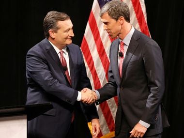 Republican U.S. Senator Ted Cruz and Democratic U.S. Representative Beto O'Rourke shake hands before their first debate for U.S. Senate in McFarlin Auditorium at SMU on September 21, 2018 in Dallas, Texas. (Nathan Hunsinger/Staff Photographer)
