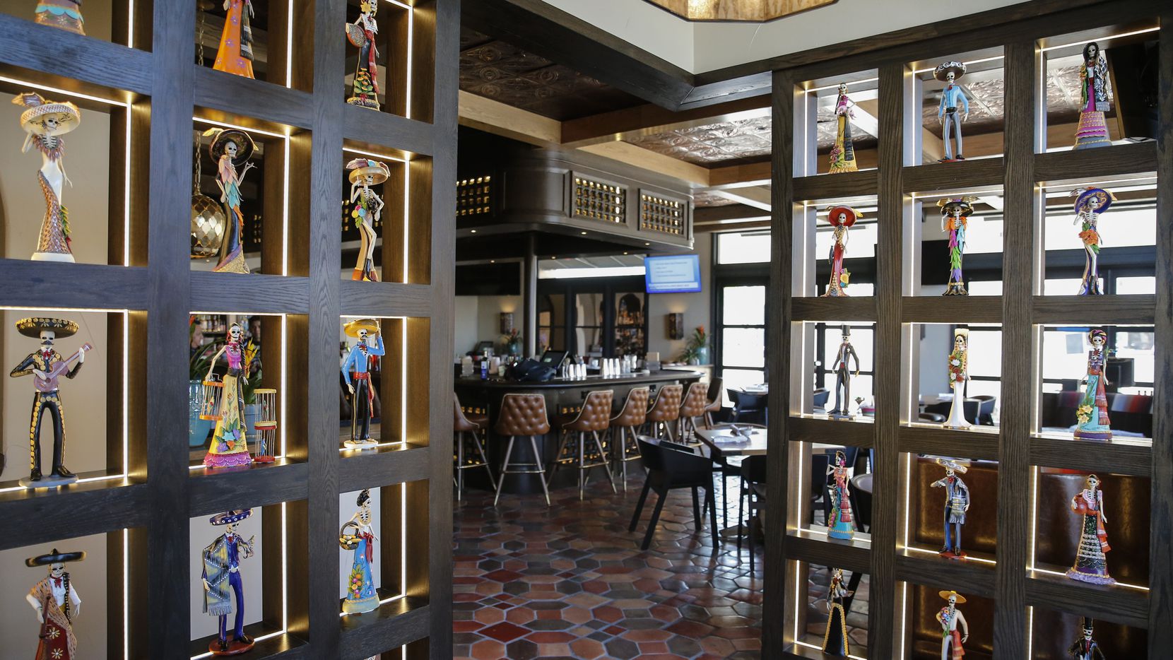 Inside the doors of Odelay in Dallas, 50 La Catrinas are on display. Restaurant co-owner...