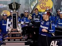 Chris Buescher celebrates with his trophy and sword after winning a NASCAR Cup Series auto...