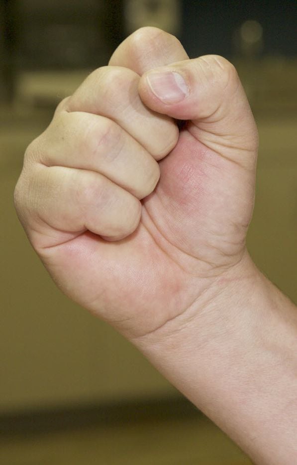 Simply making a fist helps loosen your tendons, which can help prevent injury. (Brandon...