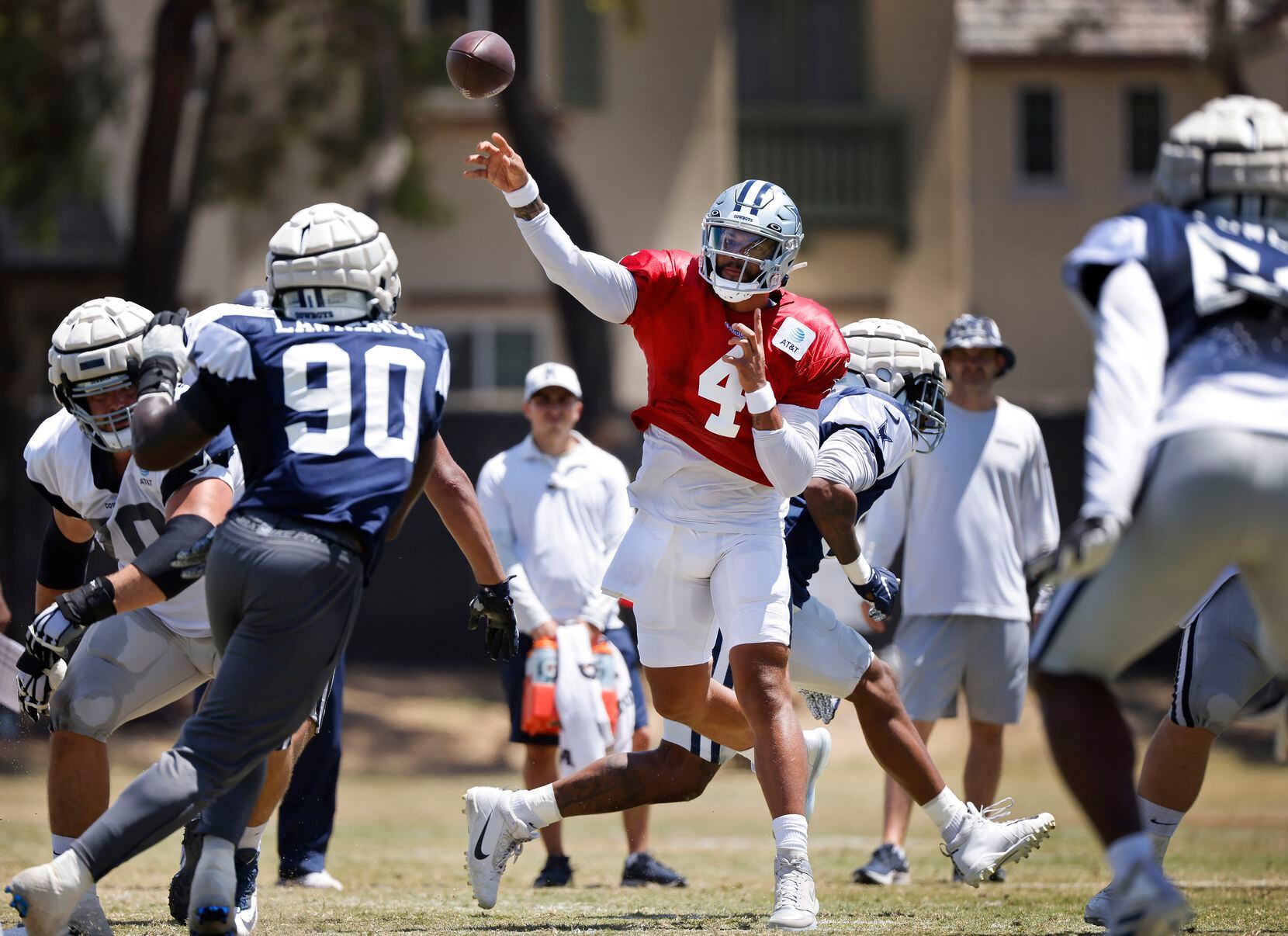 Dallas Cowboys quarterback Dak Prescott (4) throws a pass downfield during a training camp...