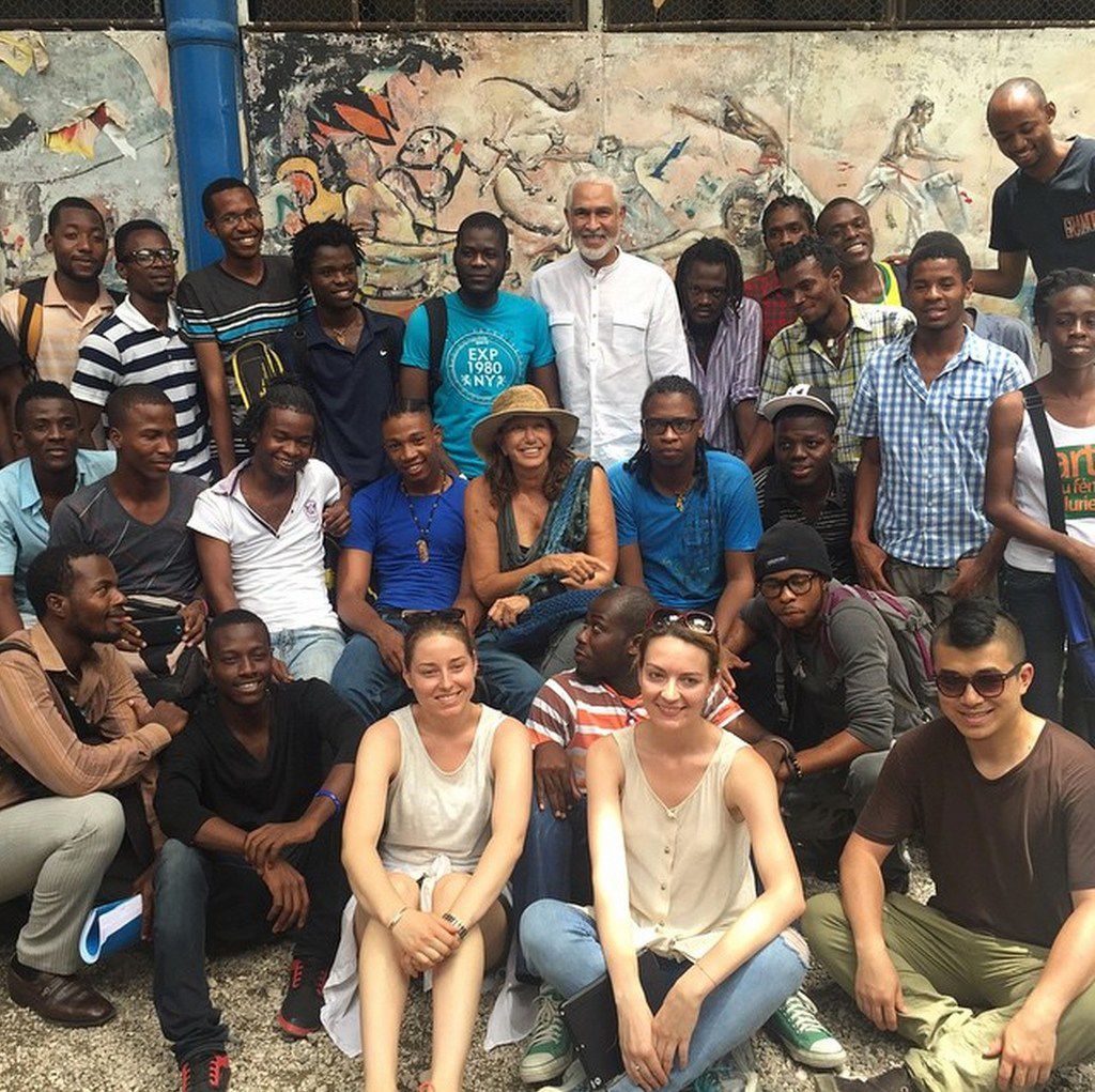 Fashion designer Donna Karan (middle) with artisans and students in Haiti. Karan's Urban Zen...