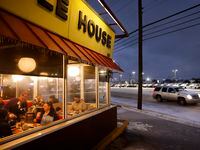 Jimmie Sloan pours a warm cup of coffee for diners keeping warm inside a Waffle House on...