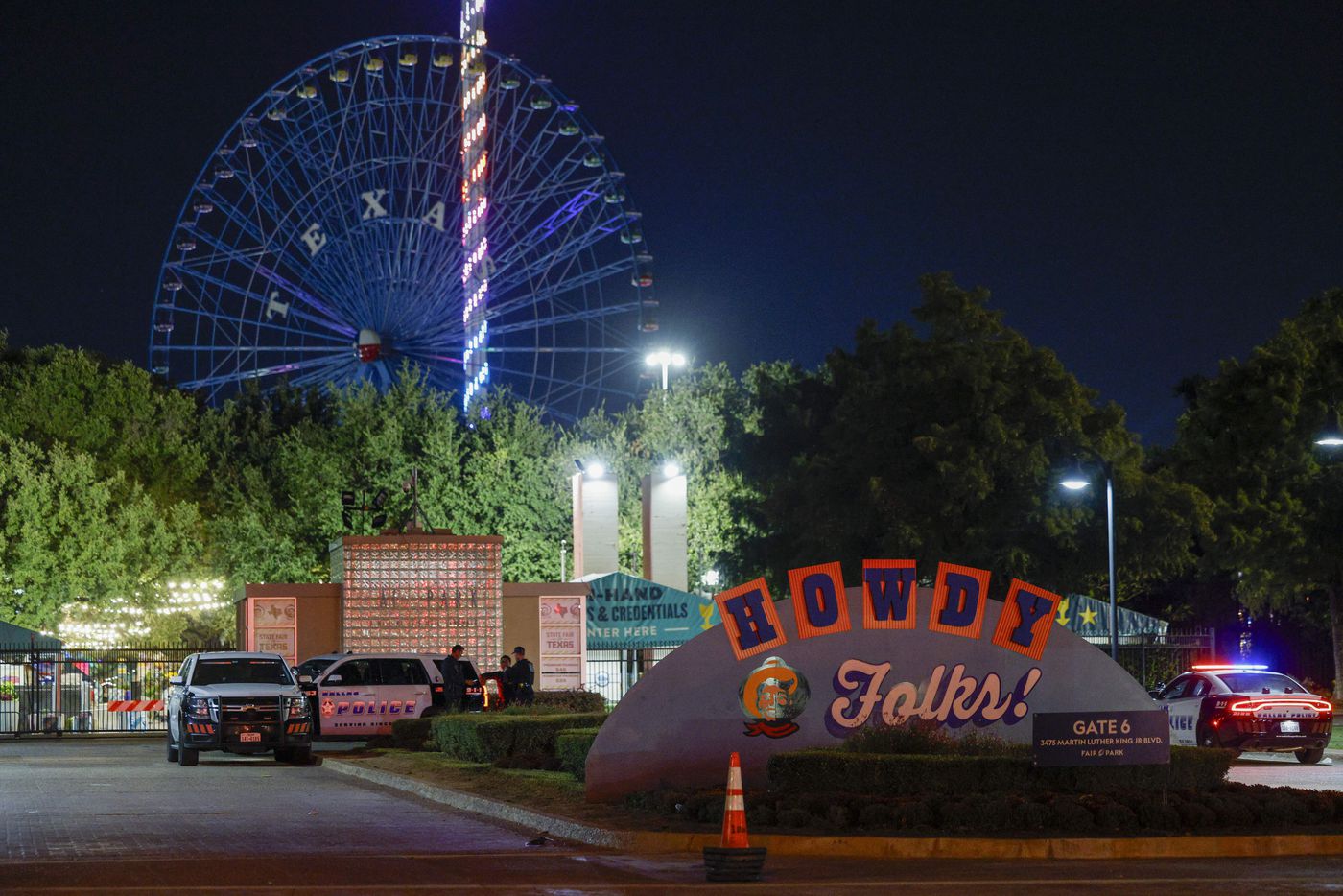 Dallas police block an entrance to the State Fair of Texas after a shooting, Saturday, Oct....