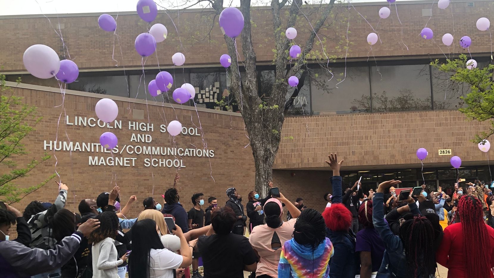 Seniors at Dallas Lincoln High School participate in a balloon release on Monday, April 12, 2021, as part of celebrations around their first day of in-person classes since the start of the COVID-19 pandemic.