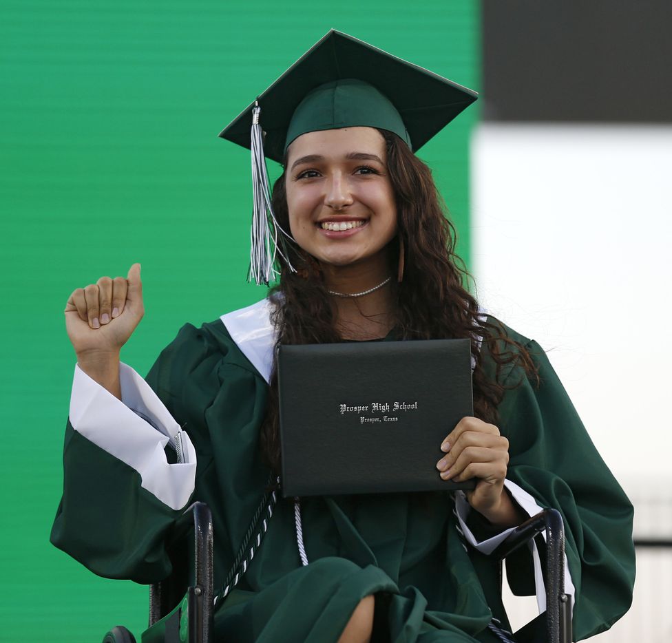 Prosper High School softball player Lexie Bell poses for a portrait after she received her...