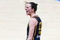 Indiana Fever guard Caitlin Clark (right) reacts after scoring form a three-pointer against...