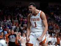 Texas forward Dylan Disu celebrates after making a basket in the second half of a...