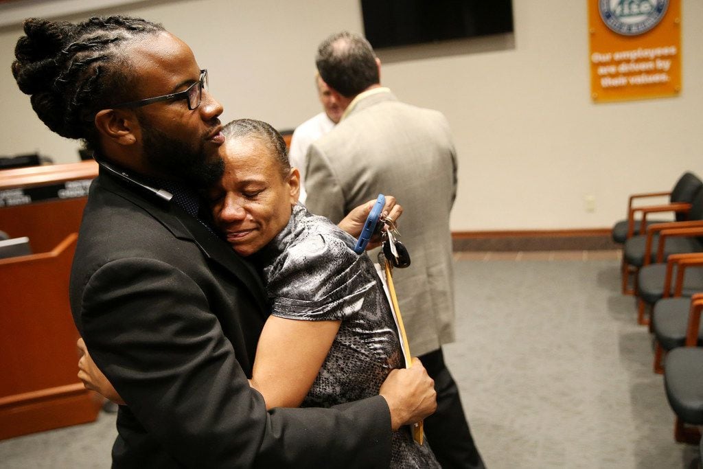 McKinney city councilman La'Shadion Shemwell hugs his mother, Rolanda Mocharia, following...