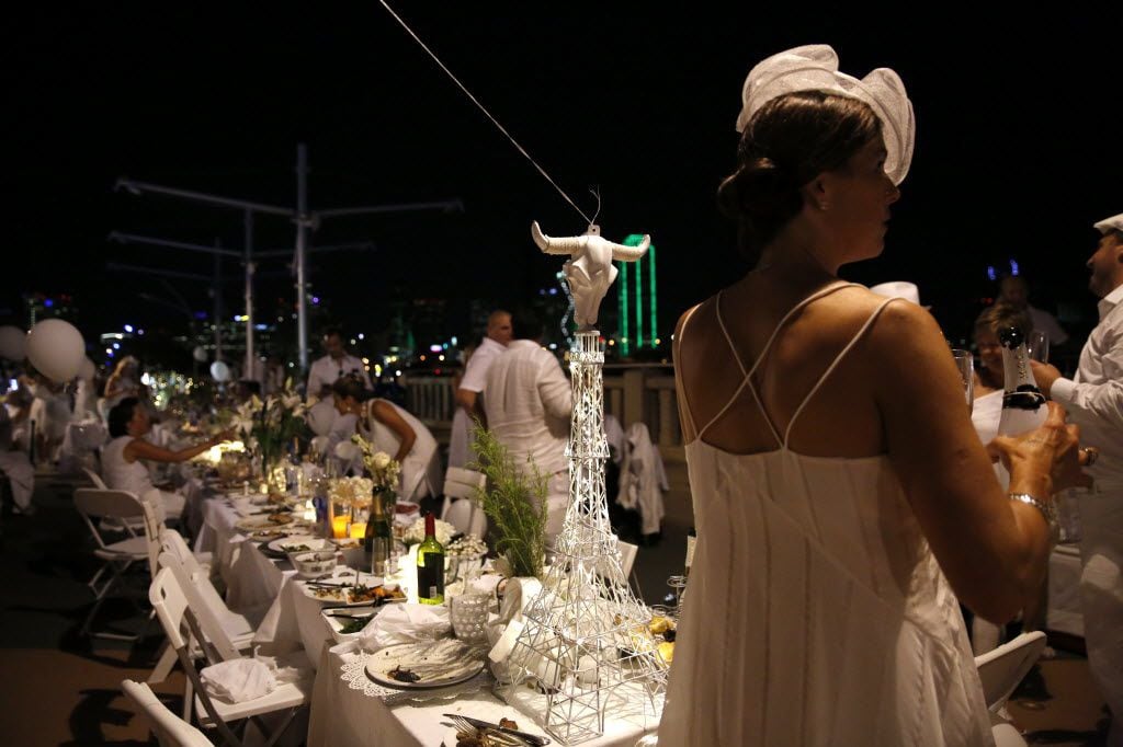 A longhorn sits atop an Eiffel Tower centerpiece during the inaugural Diner en Blanc Dallas...