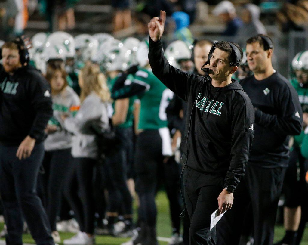 Southlake Carroll coach Riley Dodge directs his team against Lewisville during the first...