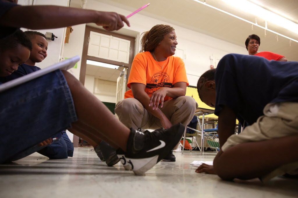 Dallas police officer Rita Graham talks to incoming third graders during the Circle of...