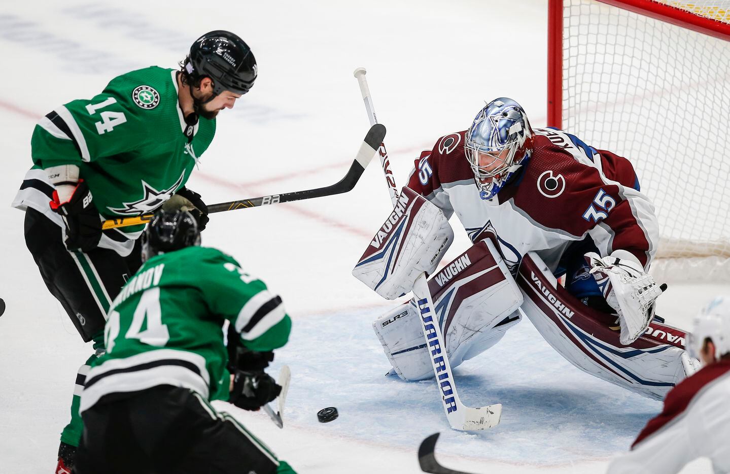 Dallas Stars forward Jamie Benn (14) looks on as forward Denis Gurianov (34) shoots the puck past Colorado Avalanche goaltender Darcy Kuemper (35) for a goal during the second period of an NHL hockey game in Dallas, Friday, November 26, 2021. (Brandon Wade/Special Contributor)