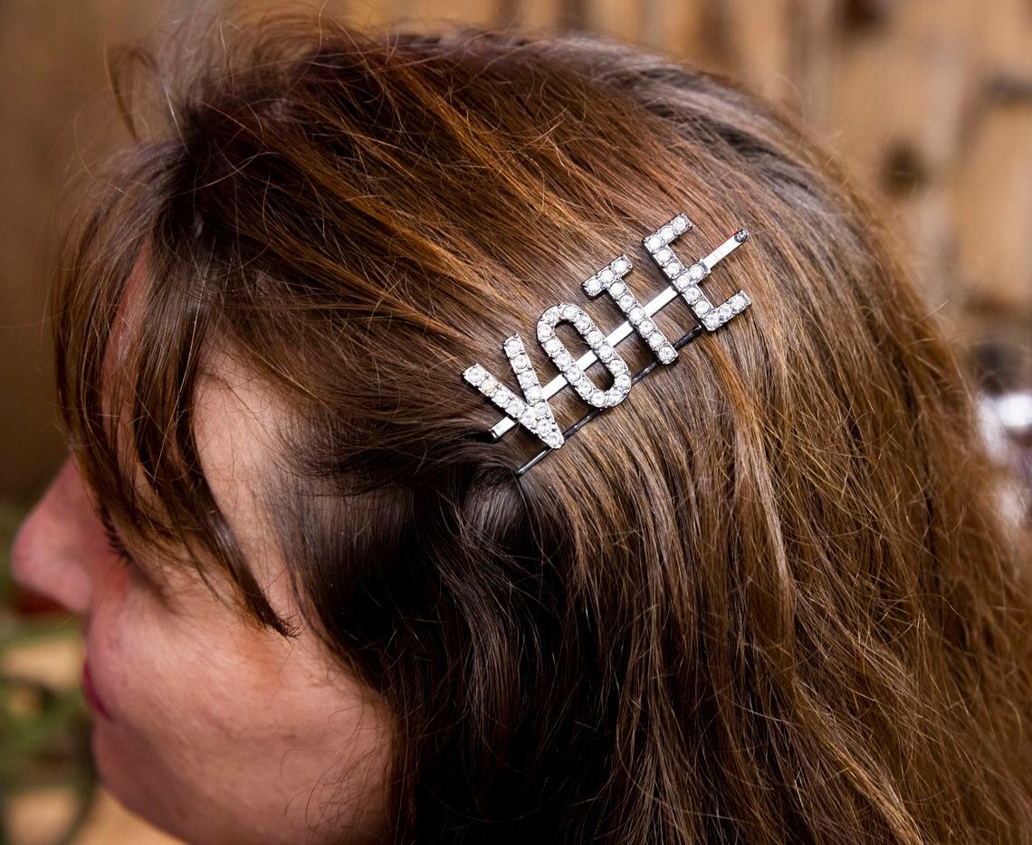 Buffy Smith of Allen wears a vote pin in her hair during a Collin County GOP Election Night...