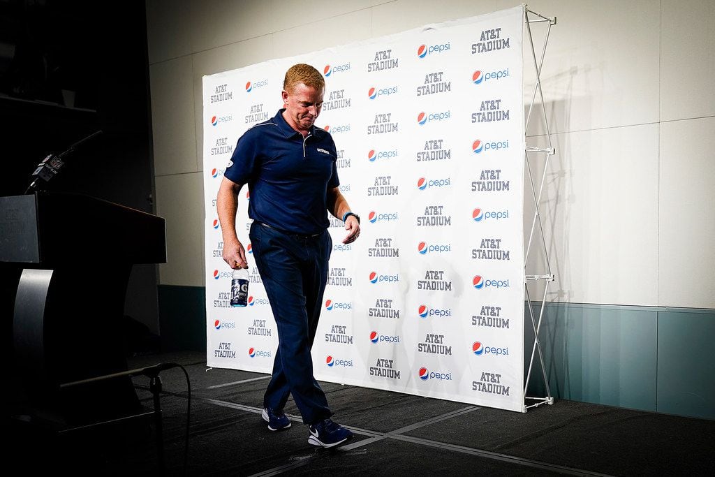Dallas Cowboys head coach Jason Garrett walks away from the podium after addressing the...