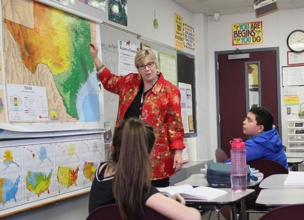 At Crownover Middle School in Corinth in 2019: Teacher Pat Dedijer shows her 7th-grade...
