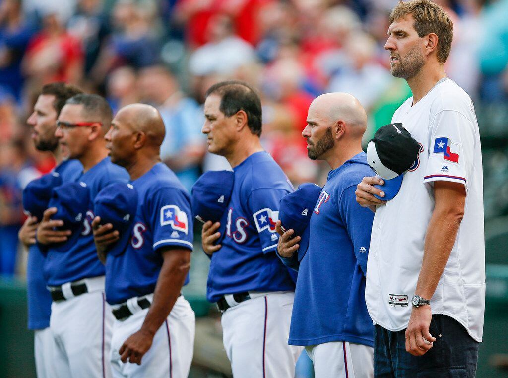Former Dallas Mavericks player Dirk Nowitzki, far right, stands with Texas Rangers manager...
