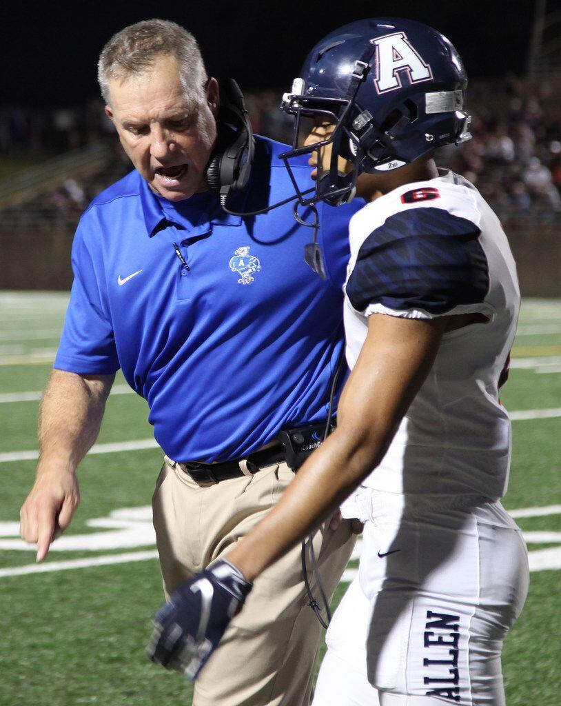 Allen High School head coach Terry Gambill gives instruction to Allen High School defensive...