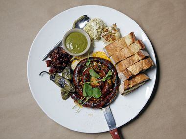 Grilled sausage by the yard with green chile mustard, dried fruit relish,  rustic toast and...