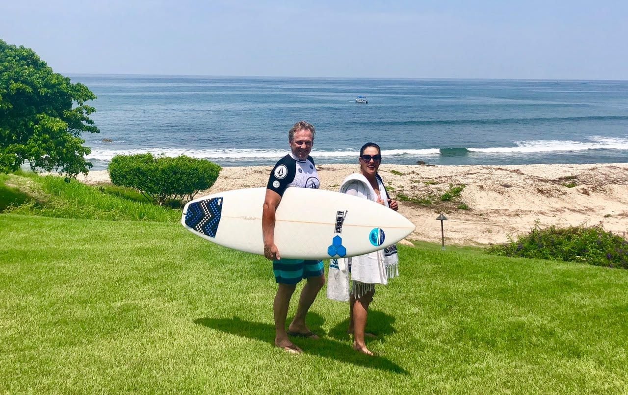 Australian native Tony Palmer (left) grew up surfing in Queensland. He and his wife, Lisa Palmer, started a sunscreen company to develop a safer, more natural alternative to chemical sunscreens.
