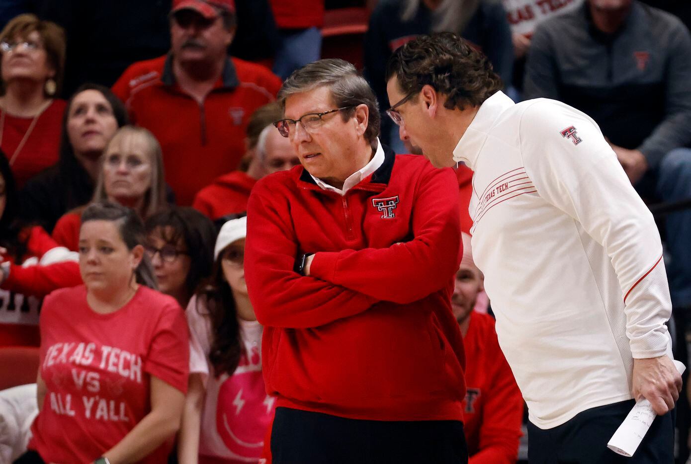 Texas Tech Red Raiders head coach Mark Adams (left) listens to his associate head coach...