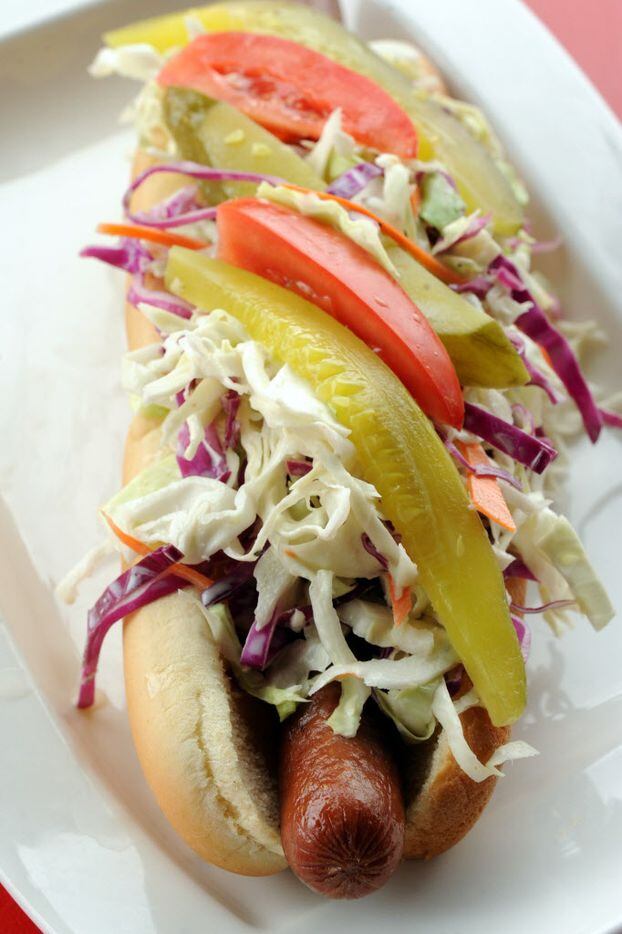 The tallywacker is a one pound frank on a fresh dog bun with mustard, onions, relish, slaw,...