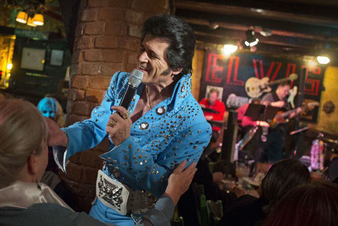Performing as Elvis Presley, tribute artist Johnny Rockit sings at El Ranchito restaurant in...