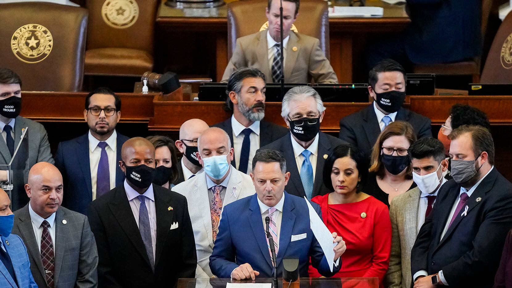 Democrats gathered around Rep. Rafael Anchía, D-Dallas, as he spoke in opposition to SB7 on the floor of the House Chamber at the Texas Capitol during the 87th Texas Legislature on May 7, 2021.