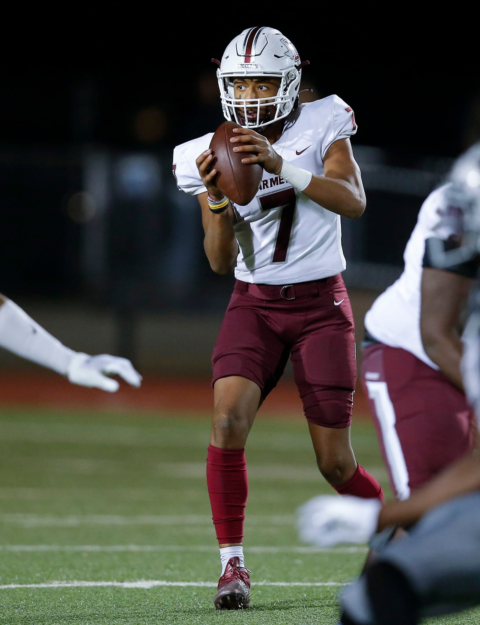 Lewisville sophomore quarterback Ethan Terrell (7) looks for an open receiver during the...