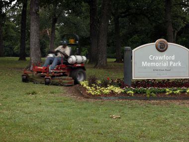 Photo taken 5/21/10 of a maintenance worker mowing at Crawford Memorial Park on Elam Rd. in...
