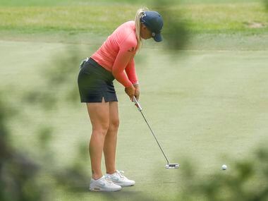 Professional golfer Matilda Castren putts a ball on the No. 1 green during the final round...