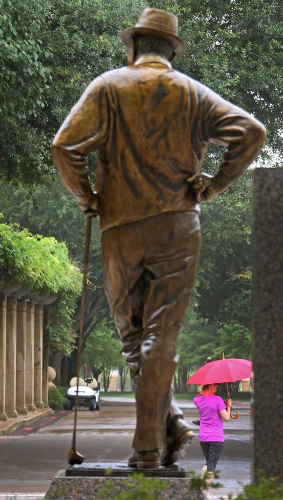 The statue of Byron Nelson oversees the rainy morning hours during the morning practice...