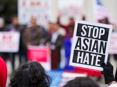 A woman holds a sign reading “Stop Asian Hate” during a rally in opposition to Texas Senate...